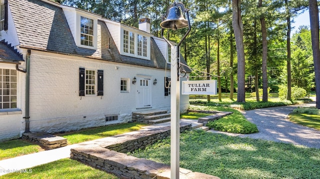 25 Sheffield Rd, Egremont, MA 01230 - view of front facade featuring brick siding, a chimney, entry steps, and a front yard