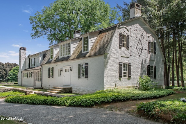 25 Sheffield Rd, Egremont, MA 01230 - colonial inspired home with a chimney and brick siding