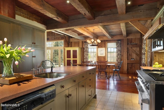 kitchen featuring appliances with stainless steel finishes, wood ceiling, sink, a notable chandelier, and beamed ceiling