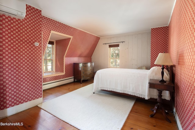 25 Sheffield Rd, Egremont, MA 01230 - bedroom with a wall mounted air conditioner, a baseboard radiator, crown molding, wood-type flooring, and wallpapered walls
