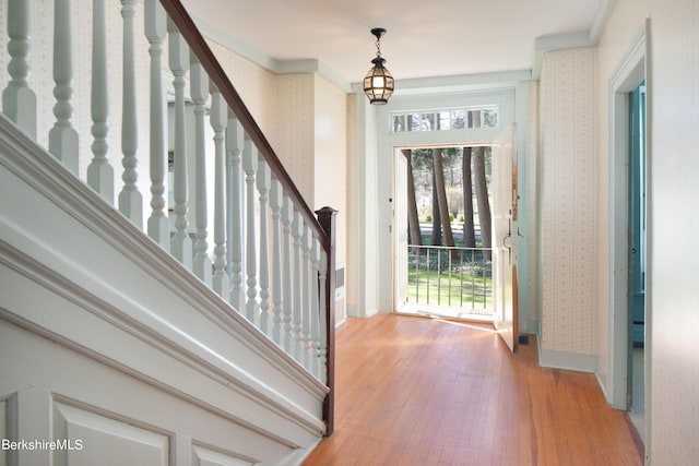 25 Sheffield Rd, Egremont, MA 01230 - foyer featuring wallpapered walls, light wood finished floors, ornamental molding, and stairs