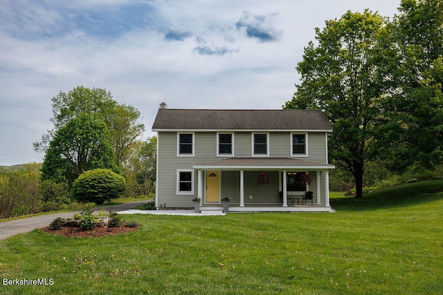 45 State Line Rd, West Stockbridge, MA 01266 - view of front facade featuring a chimney, a porch, and a front yard