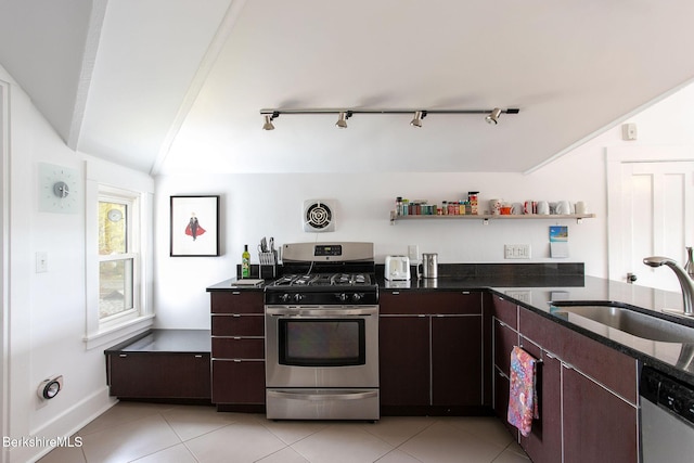 kitchen with track lighting, open shelves, a sink, appliances with stainless steel finishes, and vaulted ceiling