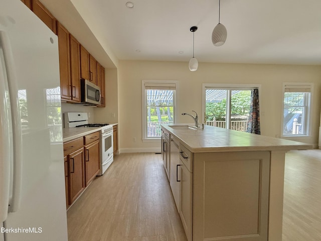 2 Copper Beech Ln, Great Barrington, MA 01230 - kitchen featuring white appliances, light wood finished floors, brown cabinets, and light countertops