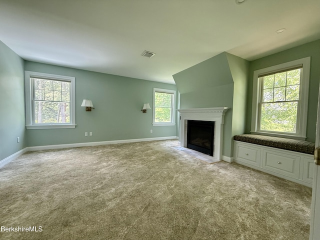 2 Copper Beech Ln, Great Barrington, MA 01230 - unfurnished living room featuring a fireplace with flush hearth and carpet flooring