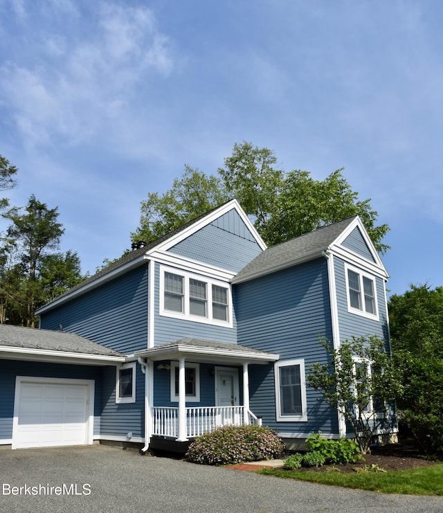 2 Copper Beech Ln, Great Barrington, MA 01230 - view of front facade with a porch, a garage, and driveway