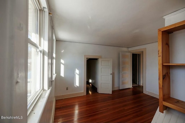 spare room with dark hardwood / wood-style flooring