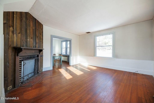 unfurnished living room featuring hardwood / wood-style floors