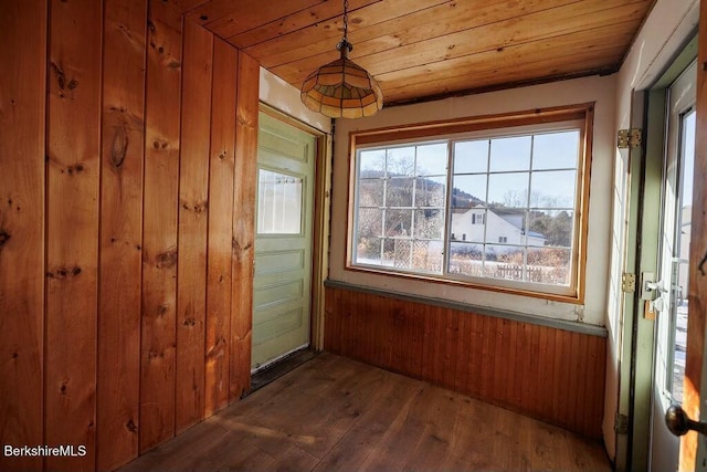 unfurnished sunroom with wooden ceiling