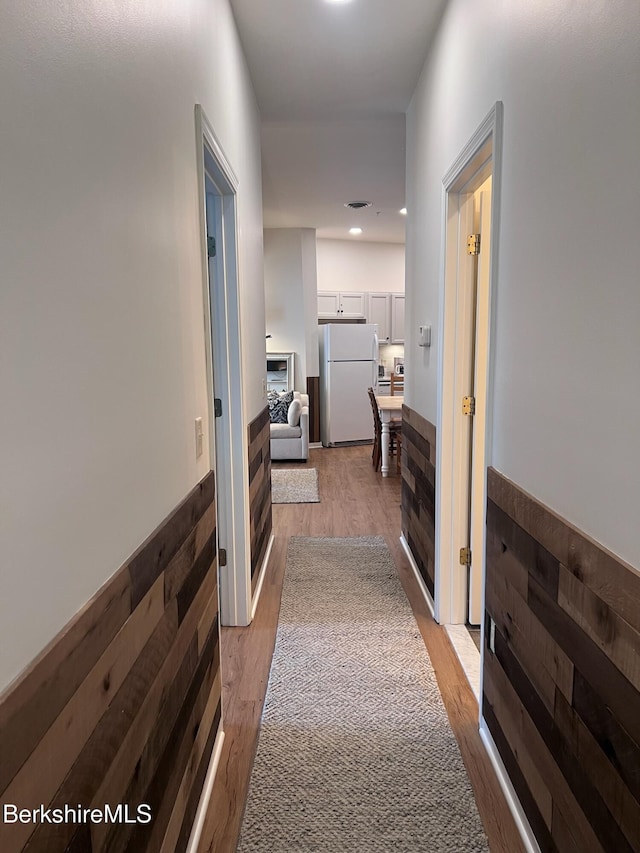 hallway featuring light hardwood / wood-style flooring