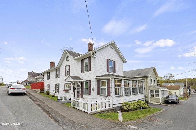 205 High St, Lee, MA 01238 - view of front of house featuring a chimney and roof with shingles