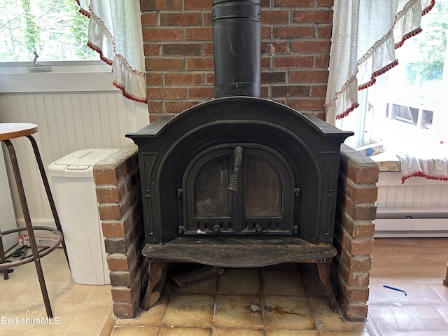 369 Pine Rd, Otis, MA 01253 - detailed view of a wood stove and baseboard heating