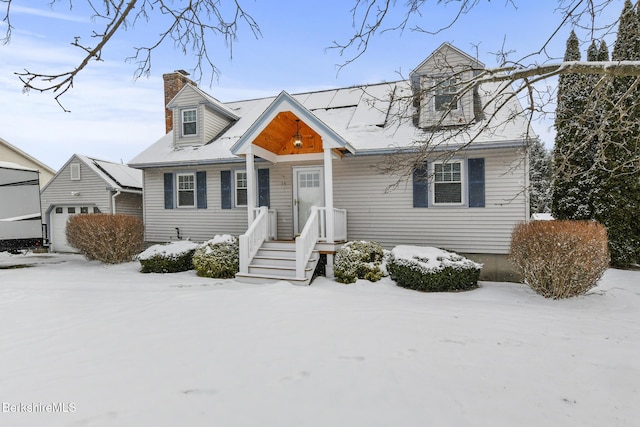 new england style home with a garage