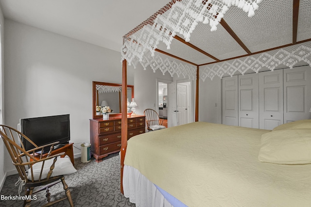 carpeted bedroom featuring a closet