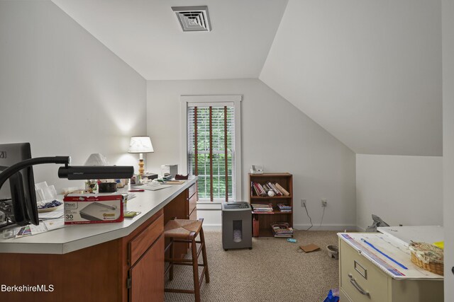 home office featuring carpet flooring, lofted ceiling, and baseboards