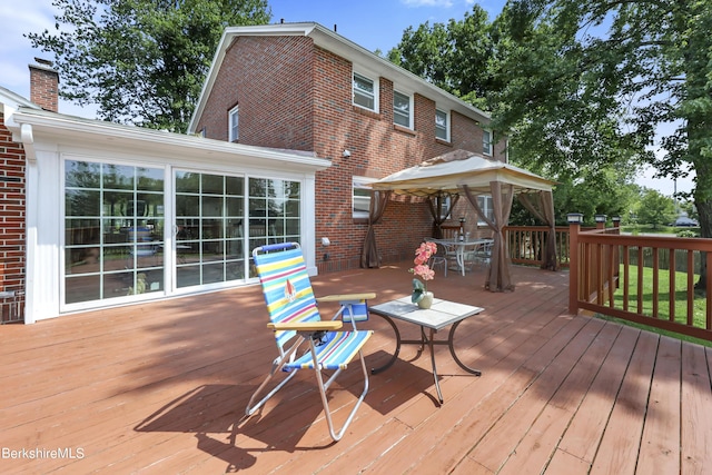 wooden deck featuring a gazebo