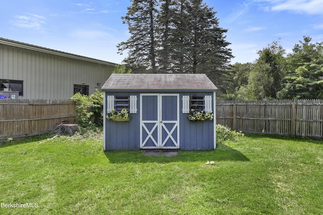 view of outbuilding with a yard