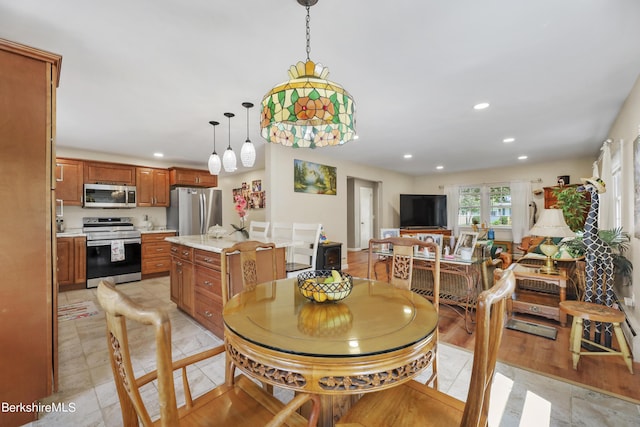 dining area featuring light tile patterned floors