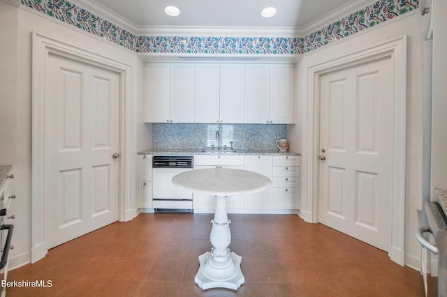 laundry area with ornamental molding and sink