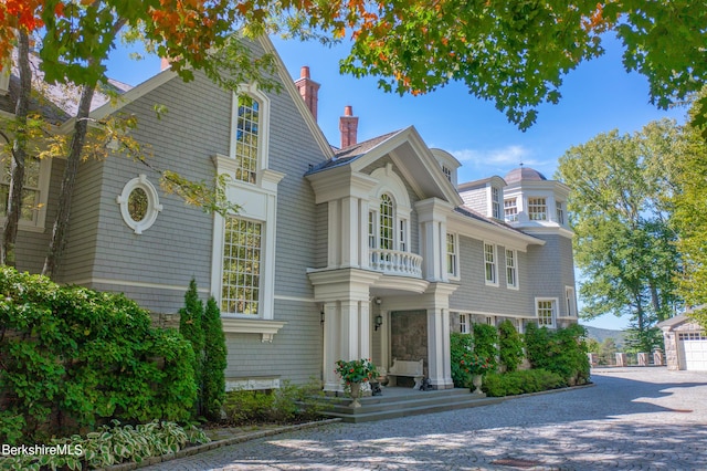 view of front of property with a balcony