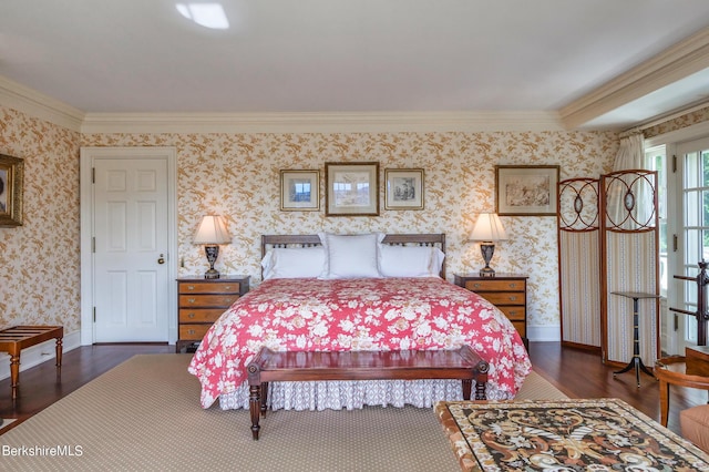 bedroom with crown molding and dark hardwood / wood-style flooring