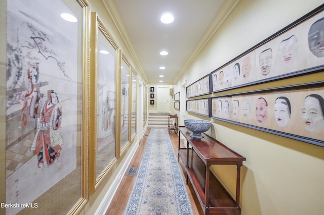 corridor with crown molding and hardwood / wood-style flooring