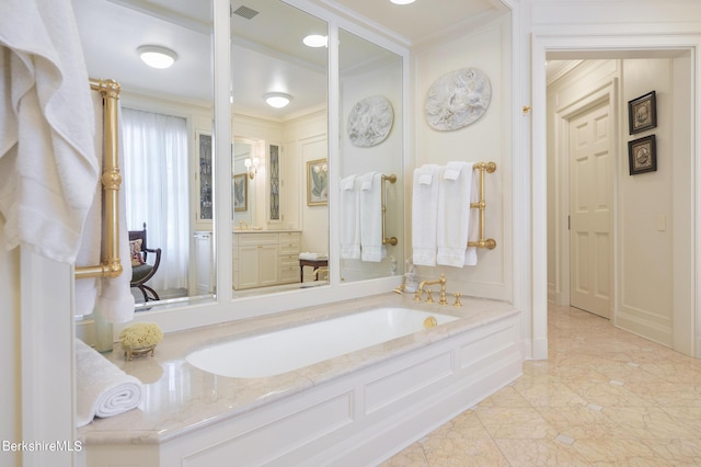 bathroom featuring a bathing tub and crown molding