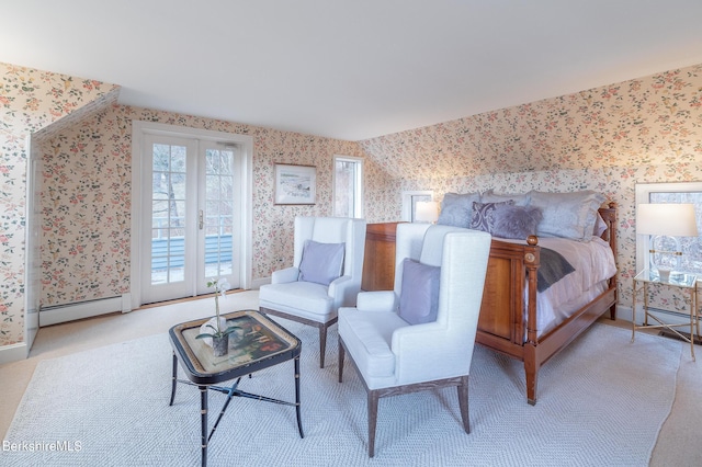 carpeted bedroom with french doors and a baseboard radiator