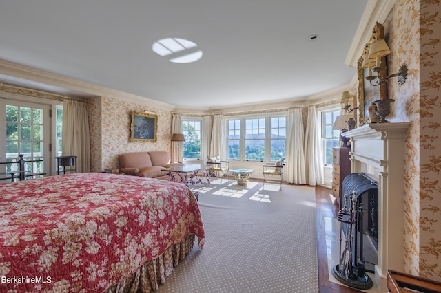 bedroom with ornamental molding and carpet floors