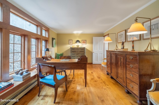 office featuring light hardwood / wood-style flooring, crown molding, and a baseboard heating unit