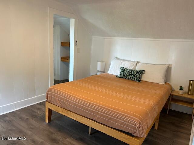 31 Richmond Ln, Adams, MA 01220 - bedroom featuring wood finished floors, vaulted ceiling, and a decorative wall