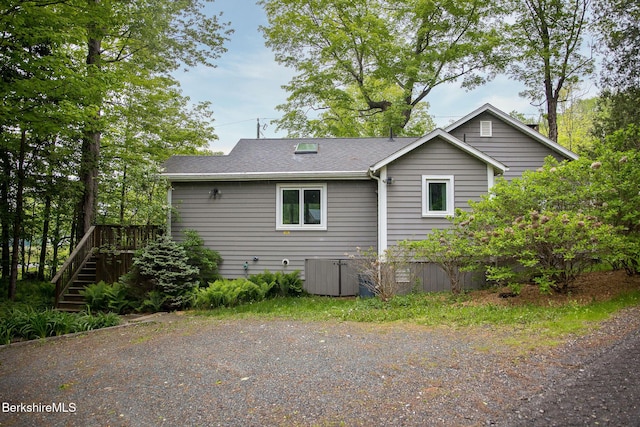 10 Elm Rd, Richmond, MA 01254 - view of property exterior with stairs, a shingled roof, and a wooden deck