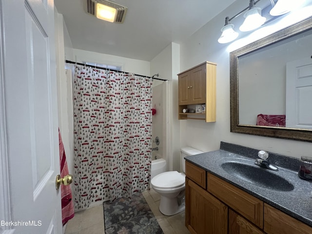 full bathroom featuring tile patterned flooring, vanity, toilet, and shower / bath combo with shower curtain