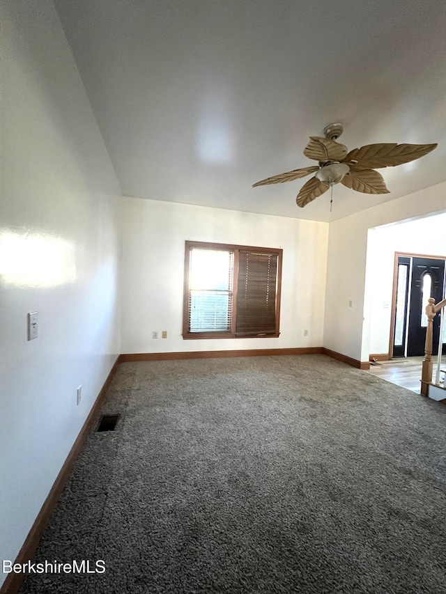 empty room featuring carpet and ceiling fan