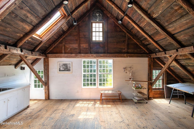 attic featuring a skylight and sink