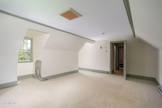 bonus room featuring light colored carpet, vaulted ceiling, and a baseboard heating unit