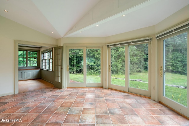 unfurnished sunroom with lofted ceiling