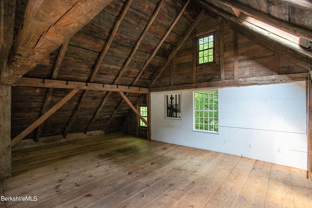 unfinished attic with a healthy amount of sunlight