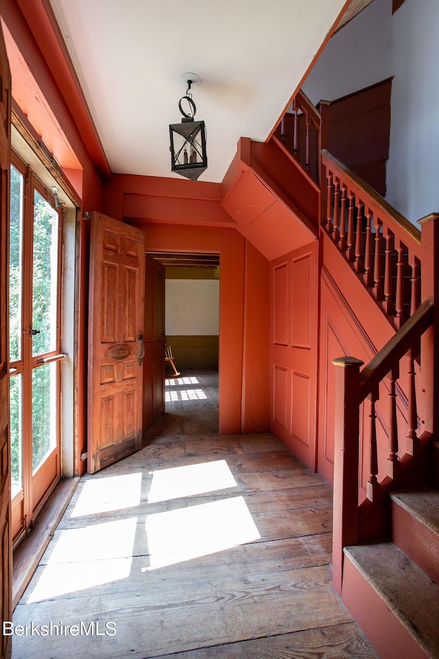 interior space with wood-type flooring and french doors