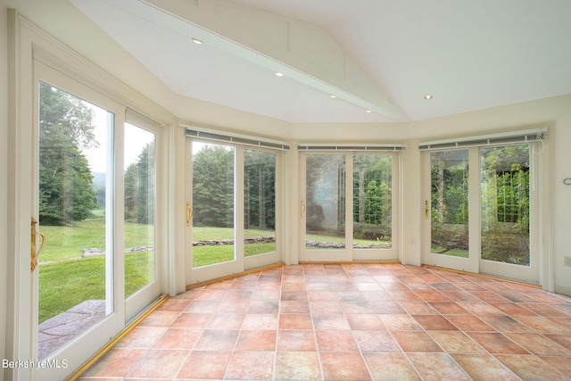 unfurnished sunroom with plenty of natural light and vaulted ceiling