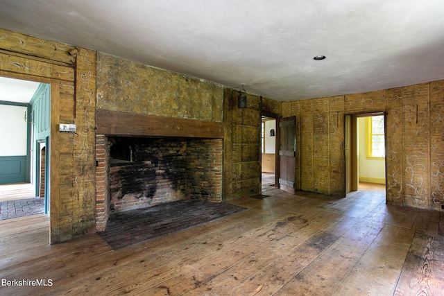 unfurnished living room with hardwood / wood-style floors