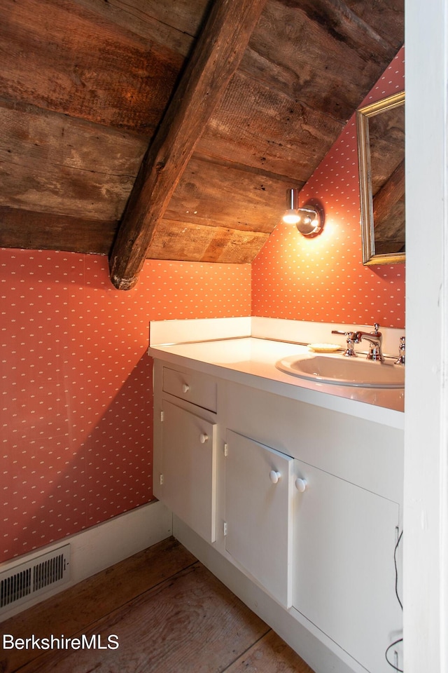 bathroom featuring vaulted ceiling with beams, vanity, and wooden ceiling