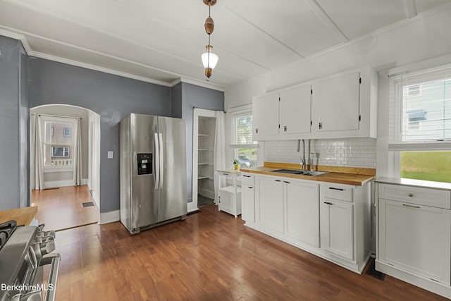 450 E Main St, North Adams, MA 01247 - kitchen with stainless steel refrigerator with ice dispenser, range, ornamental molding, white cabinets, and tasteful backsplash