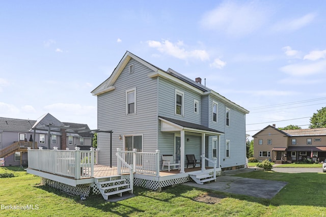 450 E Main St, North Adams, MA 01247 - rear view of house with a yard, a chimney, a wooden deck, and a residential view
