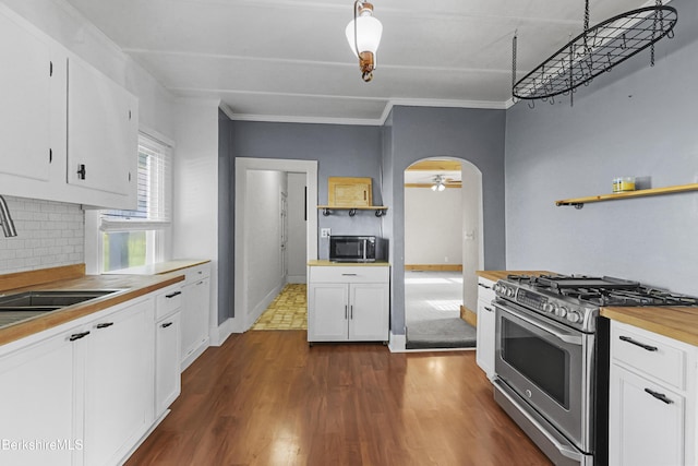 450 E Main St, North Adams, MA 01247 - kitchen featuring appliances with stainless steel finishes, arched walkways, open shelves, and white cabinets