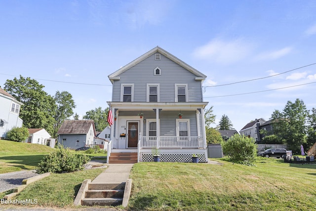 450 E Main St, North Adams, MA 01247 - traditional home featuring a porch and a front lawn