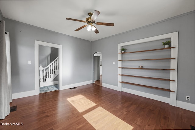 450 E Main St, North Adams, MA 01247 - unfurnished room with arched walkways, ceiling fan, wood finished floors, and stairs