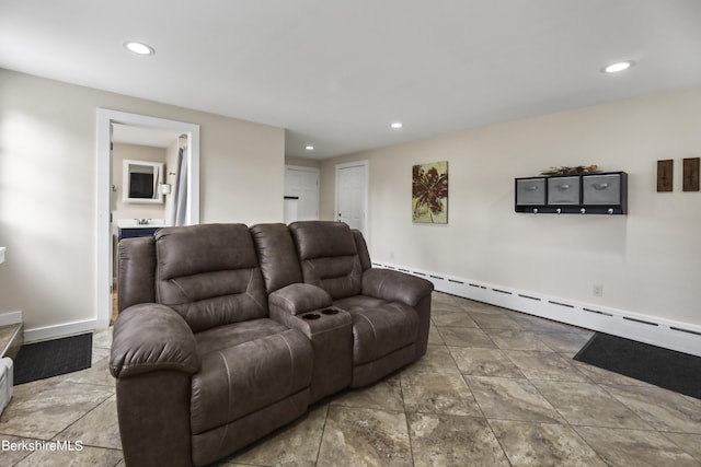 living area with baseboard heating, recessed lighting, and baseboards