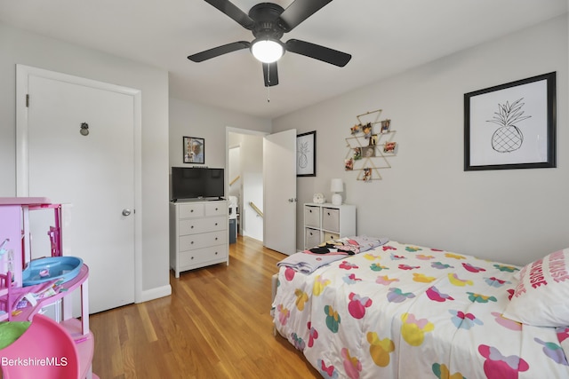 bedroom featuring a ceiling fan and light wood-style floors