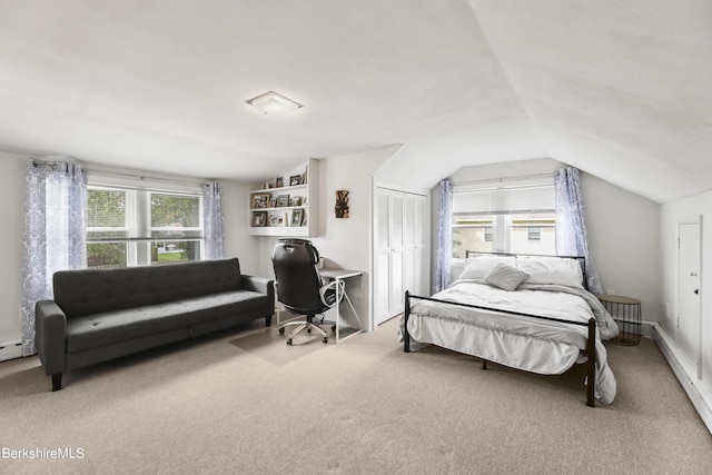 carpeted bedroom with lofted ceiling, multiple windows, a closet, and a baseboard radiator